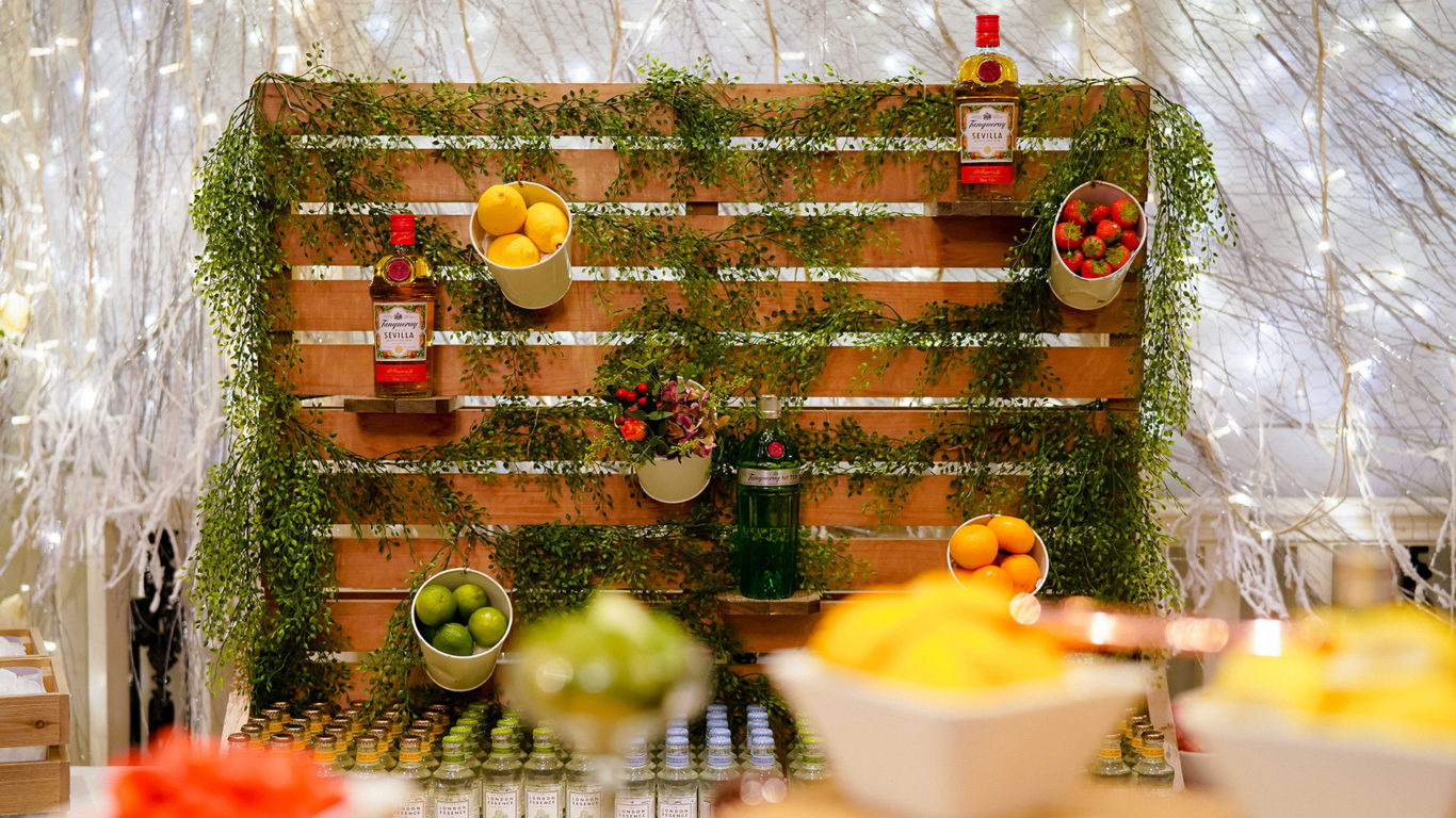 Vibrant juice bar with fresh fruits, garnishes, and ambient fairy lights, creating a lively and inviting hotel experience.