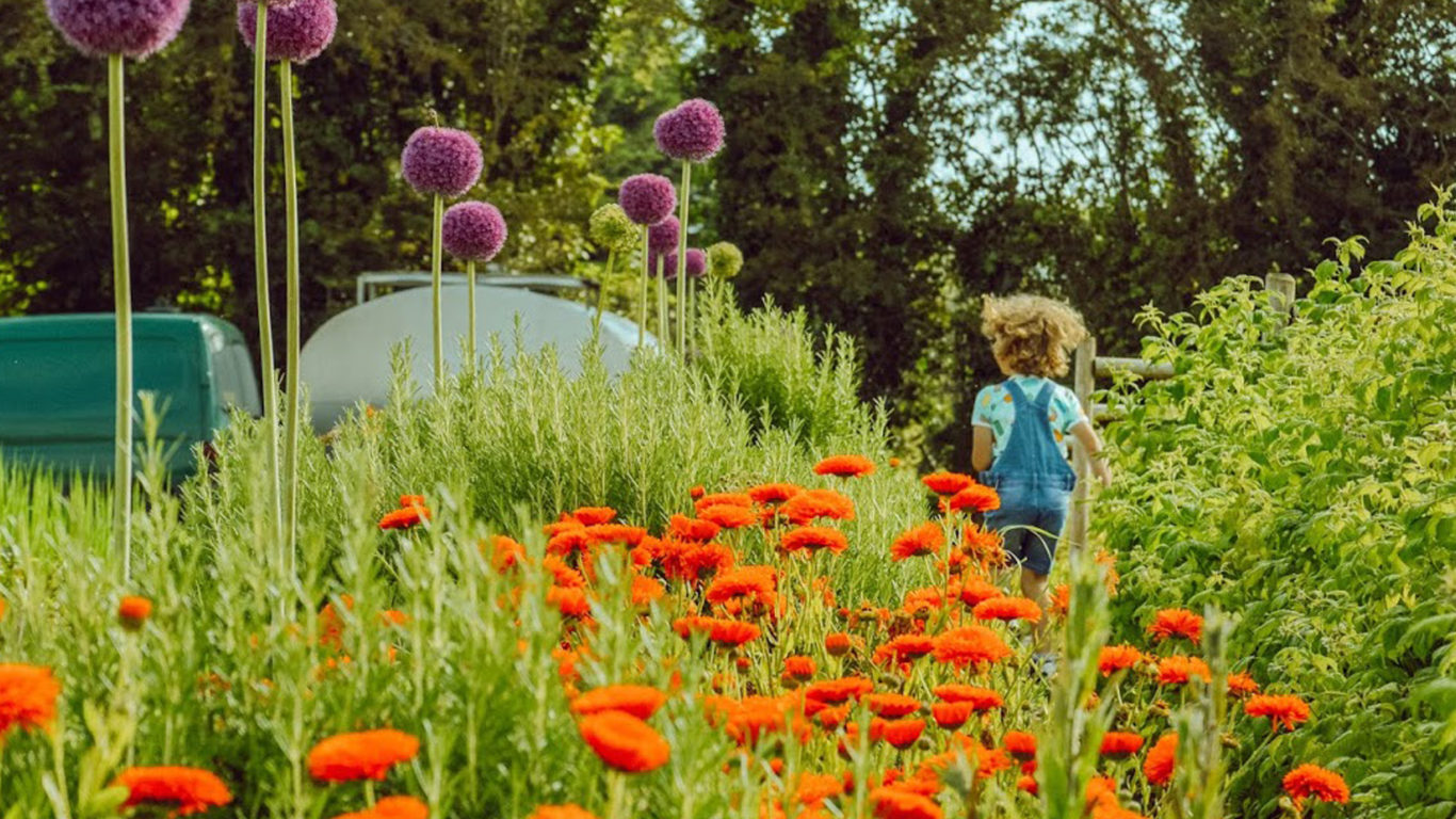 kids running through organic garden