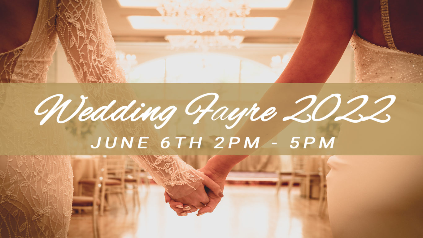Two brides in the Fitzgerald Suite with an ovelay text Wedding Fayre 2022