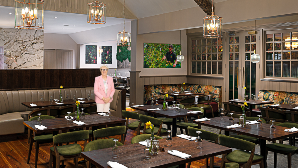 Elegant restaurant with cosy seating, warm lighting, and vibrant artwork for a relaxing dining experience.