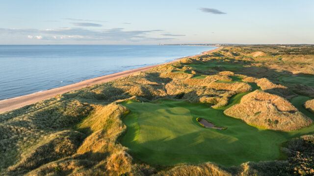 Breathtaking coastal view from the hotel with lush golf course, sandy dunes, and tranquil sea at sunset. Perfect for relaxation.