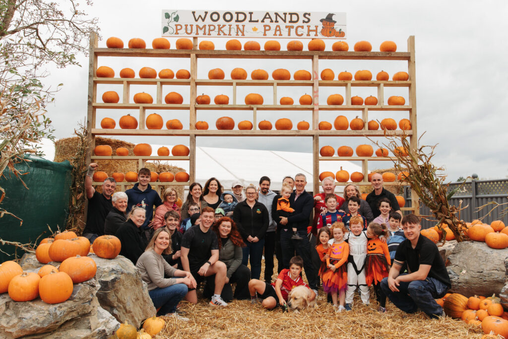 Guests enjoy festive pumpkin patch with family-friendly activities at Woodlands, perfect for a cosy autumn getaway.